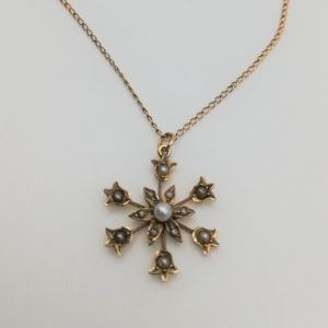 Victorian 9ct gold seed pearl star burst pendant with fine gold chain