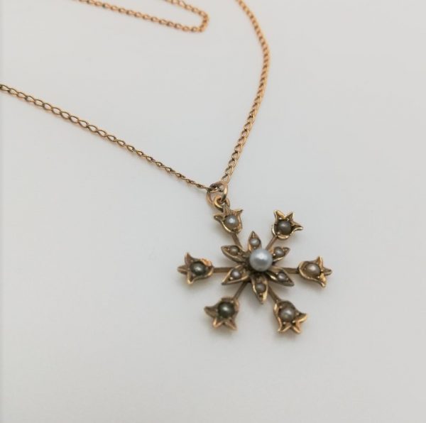Victorian 9ct gold seed pearl star burst pendant with fine gold chain