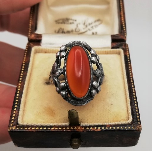 c1900 Arts and Crafts hand crafted silver ring with carnelian, foliate design