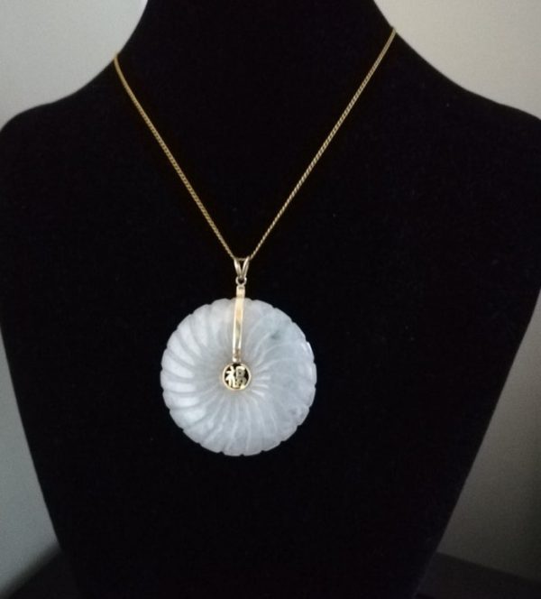 Statement carved white jade and 14ct gold disk pendant with spiral carving