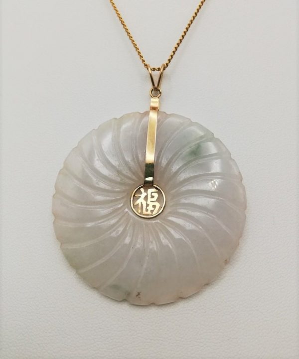 Statement carved white jade and 14ct gold disk pendant with spiral carving