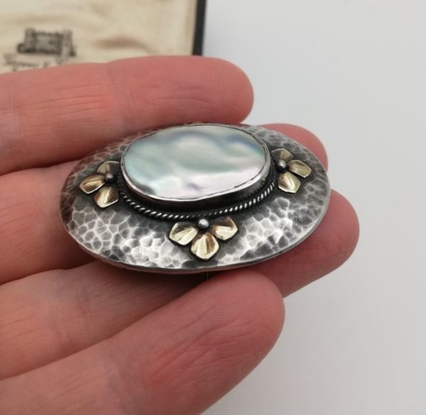 Arts and Crafts c1900 hammered silver and gilt with blister pearl brooch sold at Liberty & Co.
