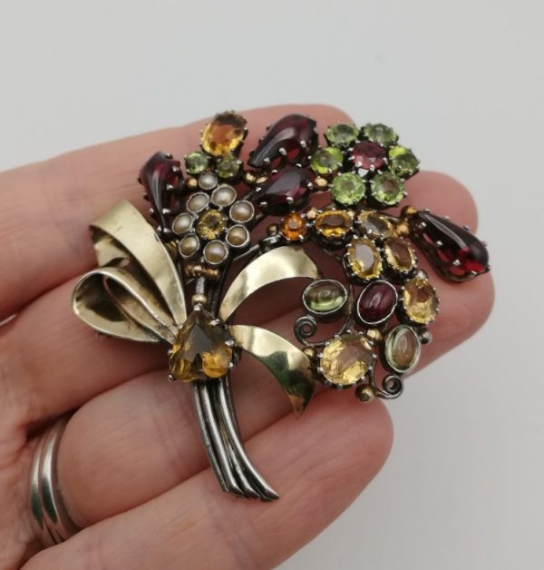 Dorrie Nossiter 1920s opulent and glamorous gem studded silver and gold flower bouquet brooch