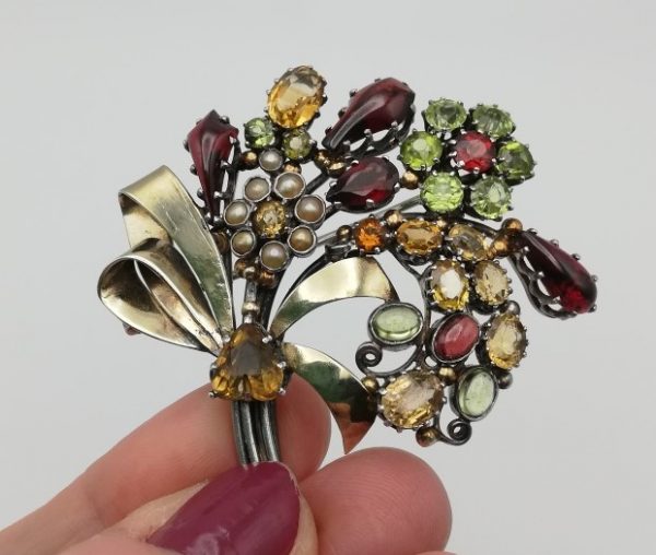 Dorrie Nossiter 1920s opulent and glamorous gem studded silver and gold flower bouquet brooch