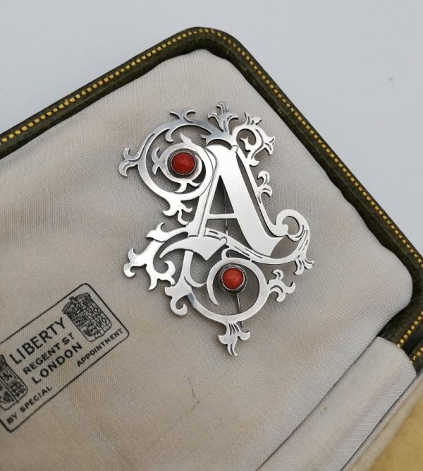 Arts and Crafts letter A ornate silver brooch with coral cabochons, London HM 1991
