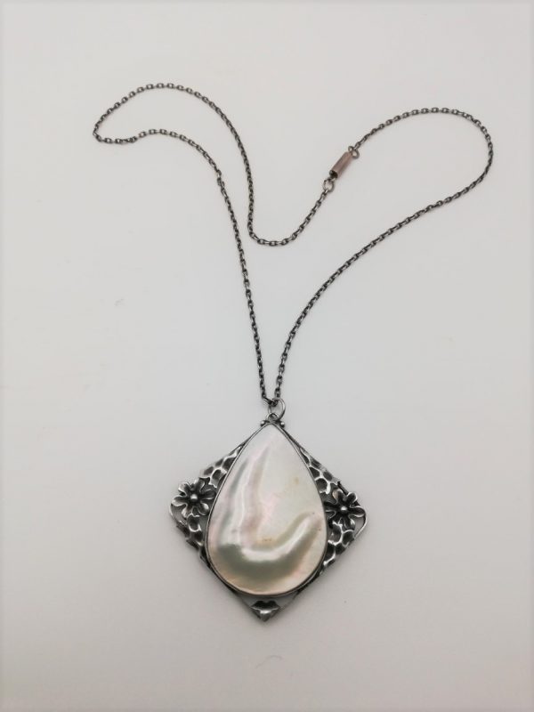 Arts and Crafts c1900 statement hammered silver flowers pendant with large blister pearl
