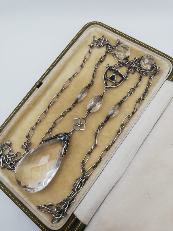 Edward Spencer for the Artificers' Guild, London c1910 long silver sautoir with impressive rock crystal pendant