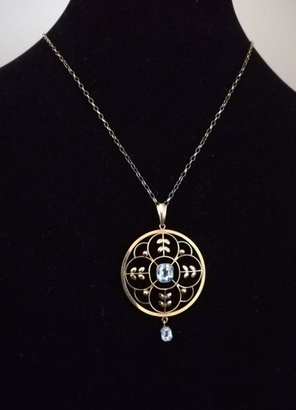 Edwardian c1910 9ct gold large, round floral pendant with aquamarine/ topaz stones