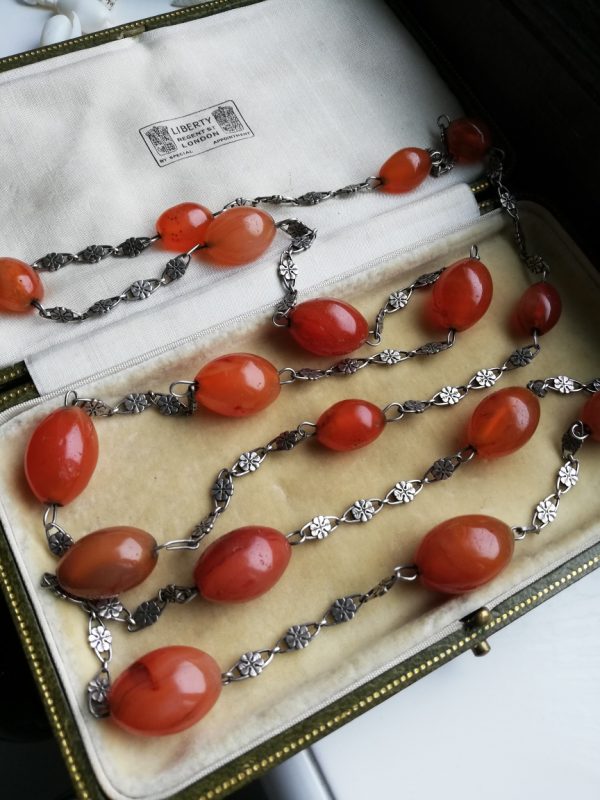 Amy Sandheim 1920s Arts and Crafts sautoir chain with sterling flower links and large carnelian stones