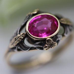 Captivating c1900 Arts and Crafts ring in gold with silver detail and synthetic pink ruby