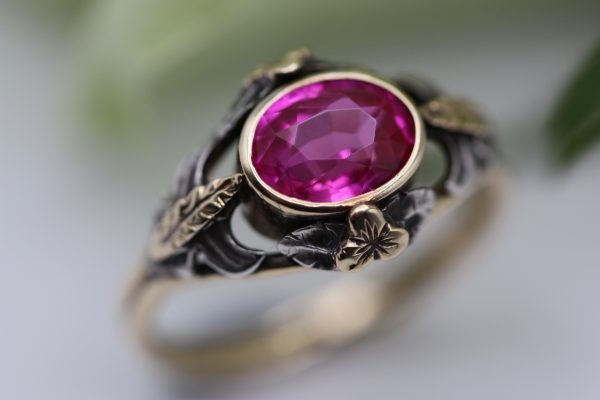 Captivating c1900 Arts and Crafts ring in gold with silver detail and synthetic pink ruby