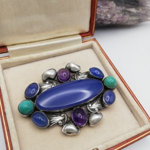 Sibyl Dunlop attr c1930 statement Arts and Crafts brooch in silver with sumptuous gemstones