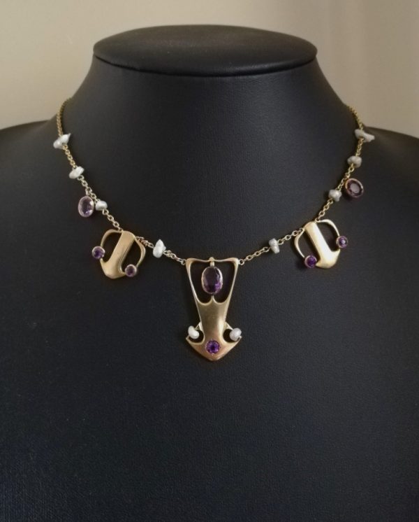 Important Archibald Knox Cymric necklace for Liberty & Co c1900 crafted in gold with amethysts and pearls