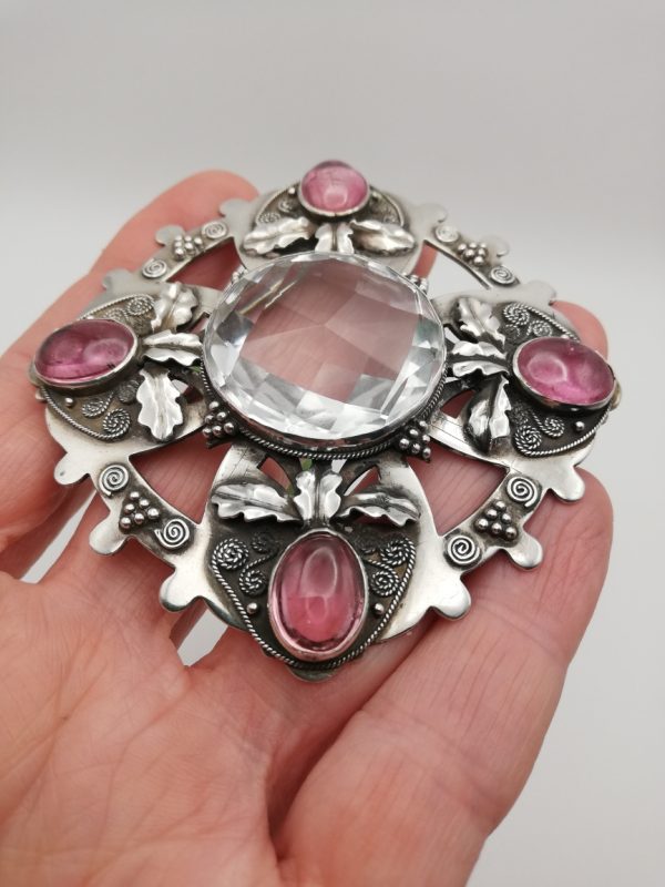 An impressive Arts and Crafts brooch c1910 attr William Thomas Blackband with rock crystal and pink tourmalines
