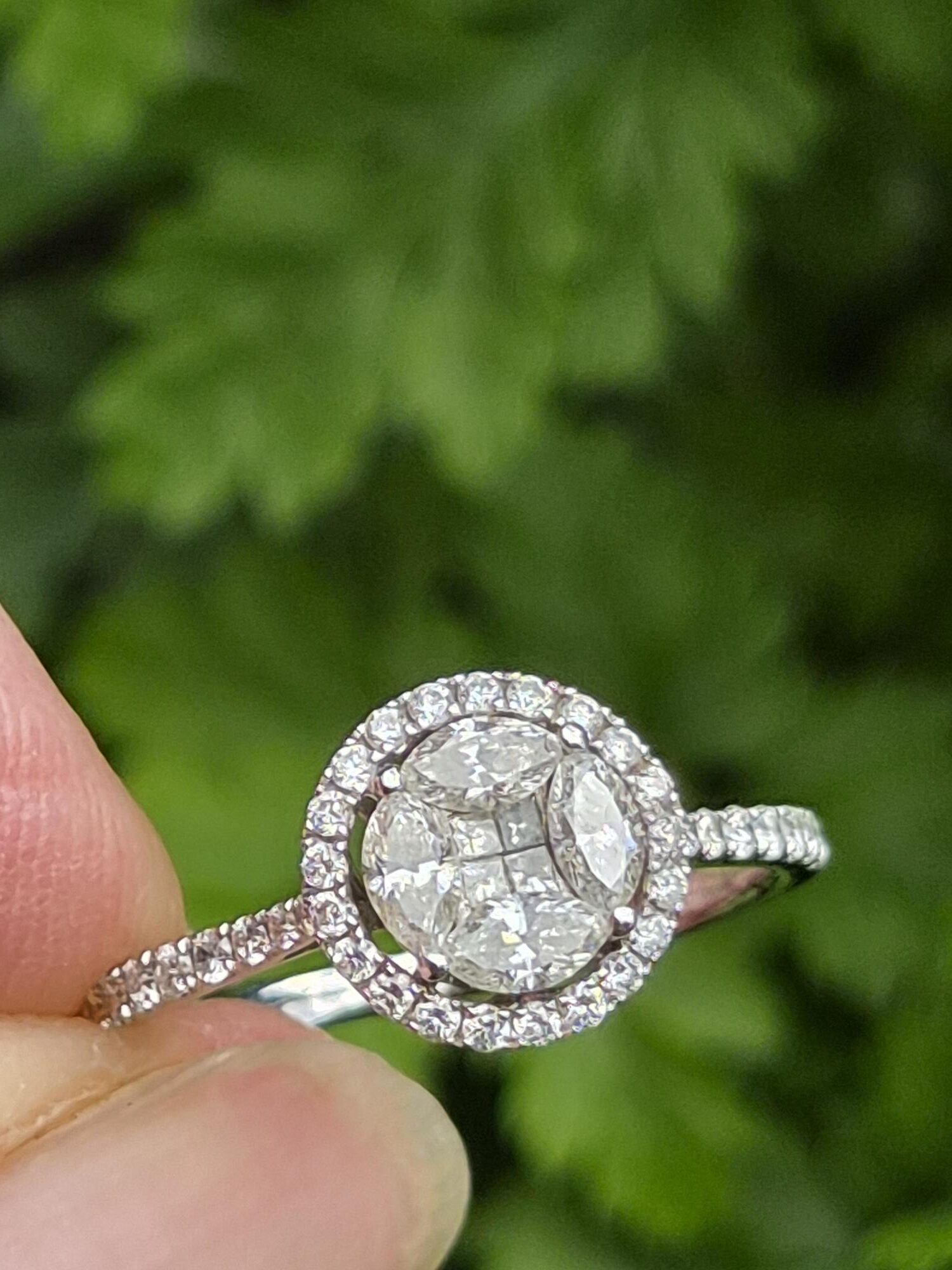 Attractive18ct white gold and 0.68ct diamond round halo ring with appraisal