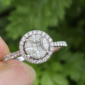 Attractive18ct white gold and 0.68ct diamond round halo ring with appraisal