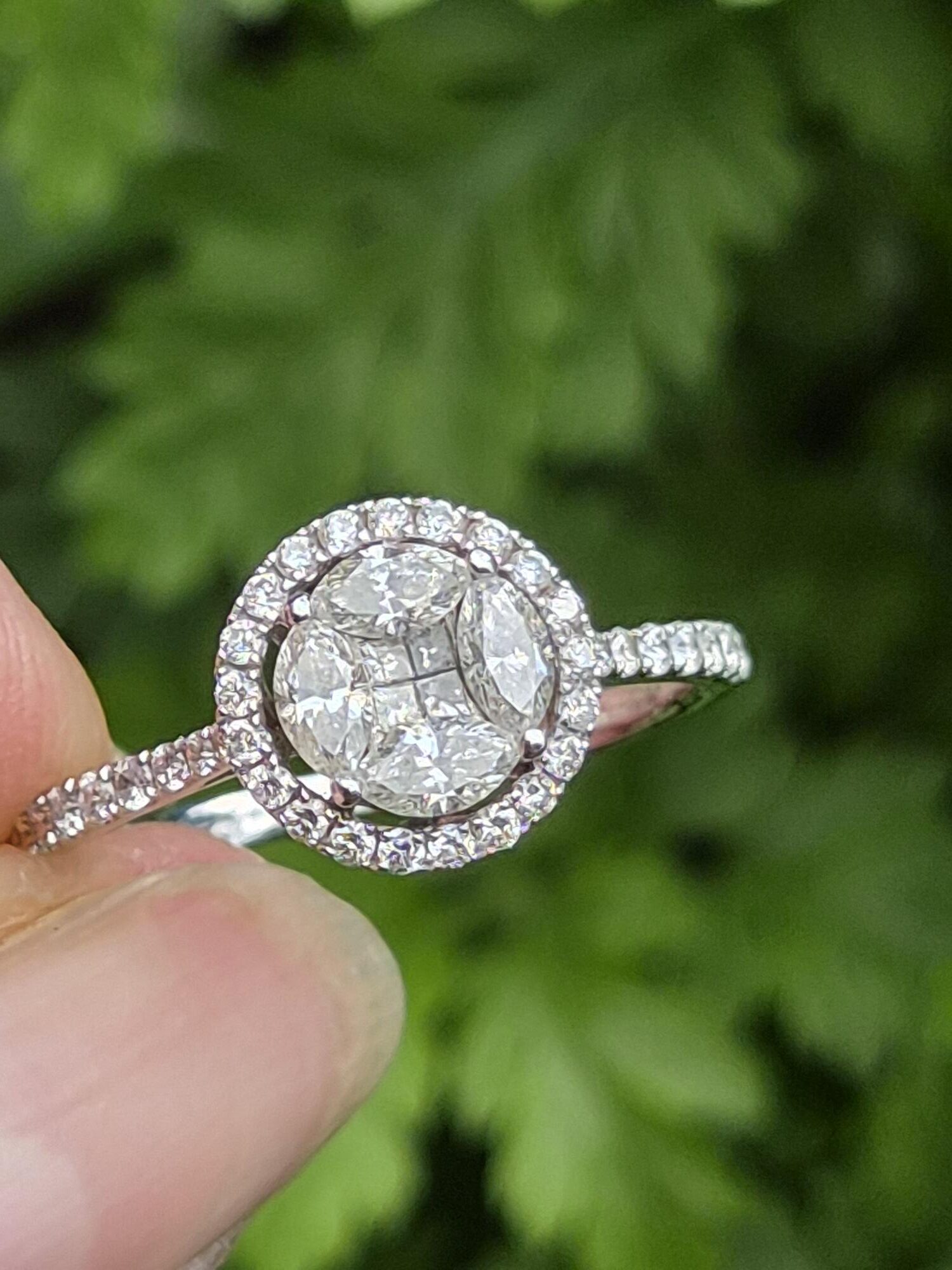 Attractive18ct white gold and 0.68ct diamond round halo ring with appraisal