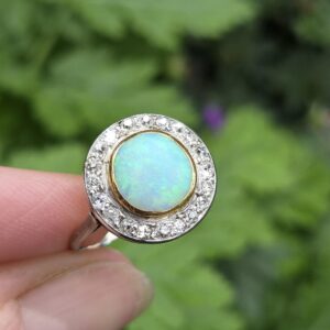 Sumptuous antique Art Deco 18ct white gold opal ring with a halo of diamonds , 21 stones in all