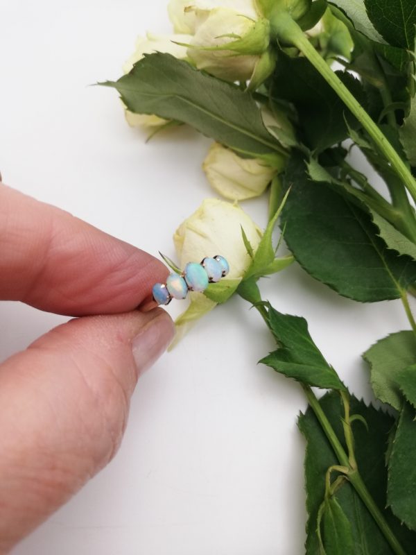 Antique English sweet 9ct gold and 5 opal ring with lively stones