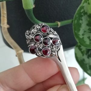 c1920 Early Bernard Instone book piece flower bouquet brooch with jammy red garnets