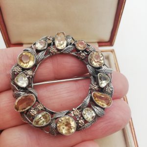 Unique early Bernard Instone Arts and Crafts citrines and peridots brooch, book piece c1925