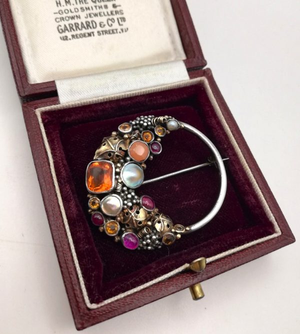 Fine Dorrie Nossiter Arts and Crafts brooch in silver with gold, fire opal and rubies c1930