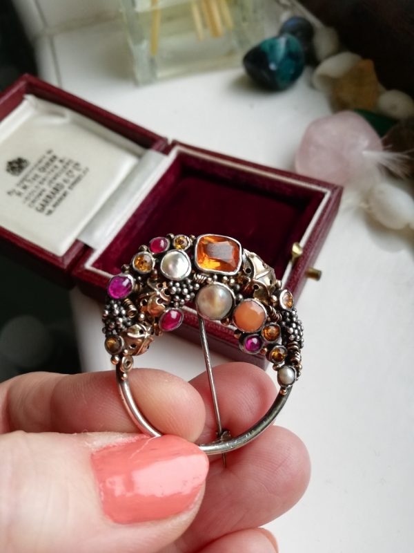 Fine Dorrie Nossiter Arts and Crafts brooch in silver with gold, fire opal and rubies c1930