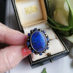 Important Sibyl Dunlop statement black opal Arts and Crafts ring with blue chalcedony c1925