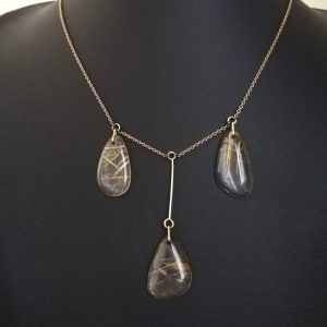 Antique 9ct gold and Venus Hair rutilated quartz trilogy lavalier necklace c1920s