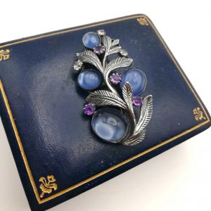 Book piece Bernard Instone Arts and Crafts brooch with blue foiled quartz, white topaz and amethyst