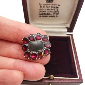 Georgian 1800s gold and flat-cut garnets hair locket mourning brooch