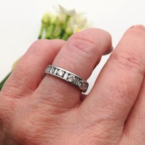Substantial platinum and 1.00ct diamonds half eternity ring with round cut and baguette cut diamonds
