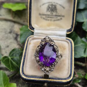 Rare early Bernard Instone silver and gold Arts and Crafts book piece ring with striking amethyst